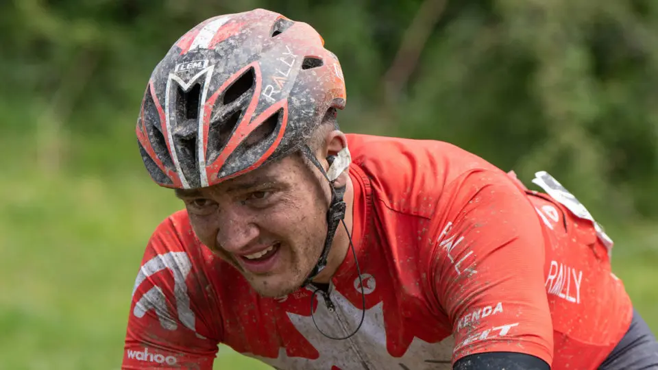 Adam de Vos racing and covered in mud
