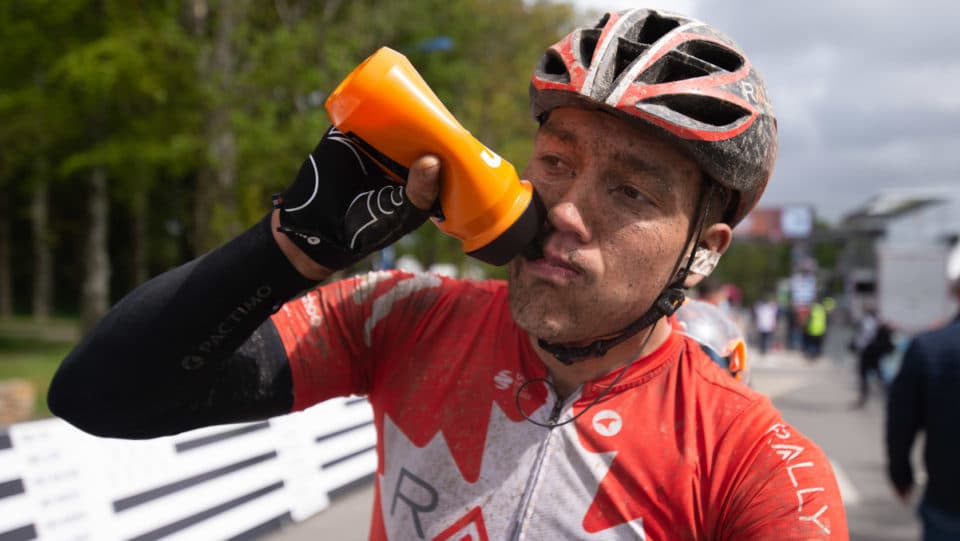 Adam de Vos drinking from race bottle