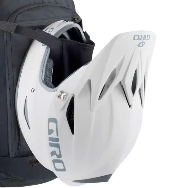 EVOC FR Trail Blackline Protector Backpack with helmet attached