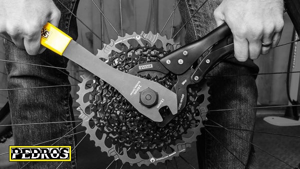 Pedro's tools being used to remove a cassette from wheel