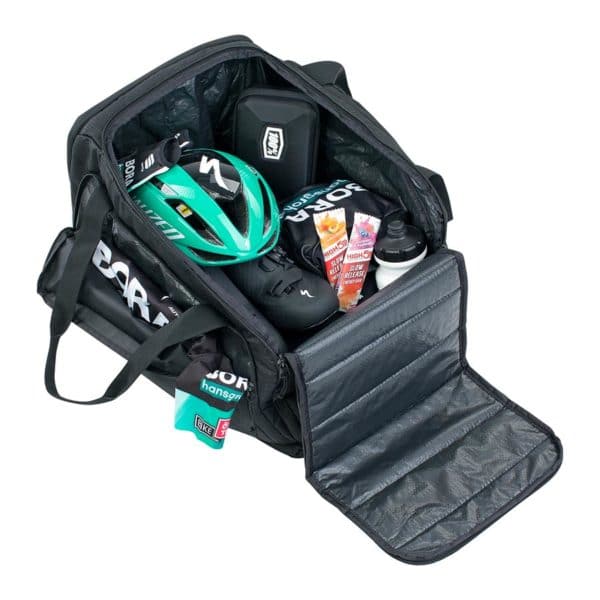 EVOC Gear Bag 35 open with road cycling gear inside