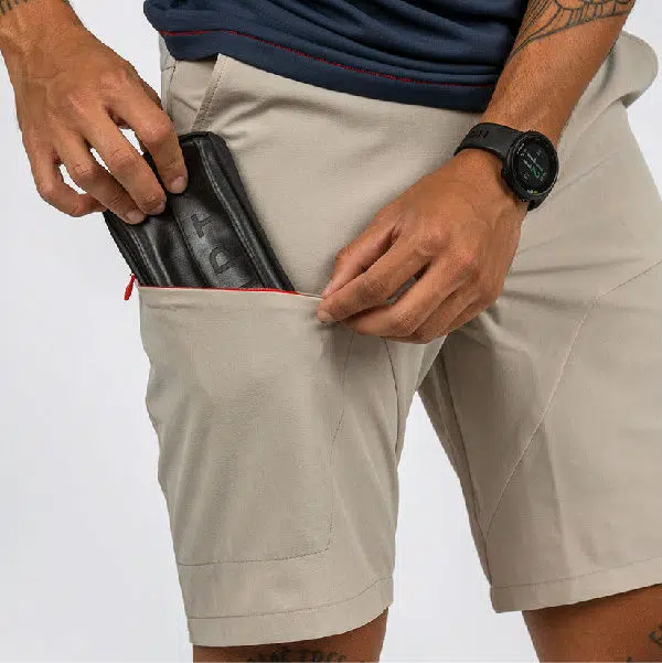CHPT3 Dirt Shorts slipping wallet into pocket