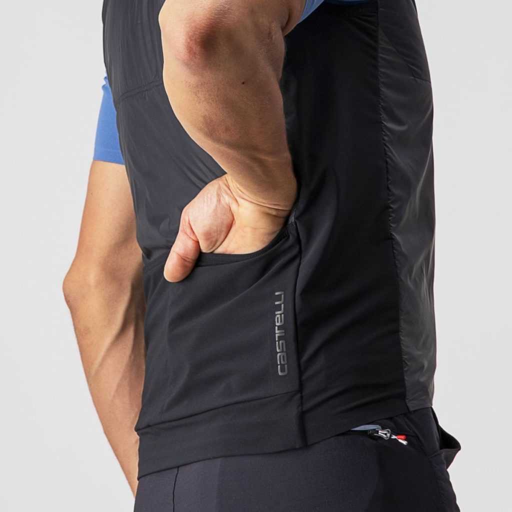 Castelli Unlimited Puffy Vest hand in back pocket