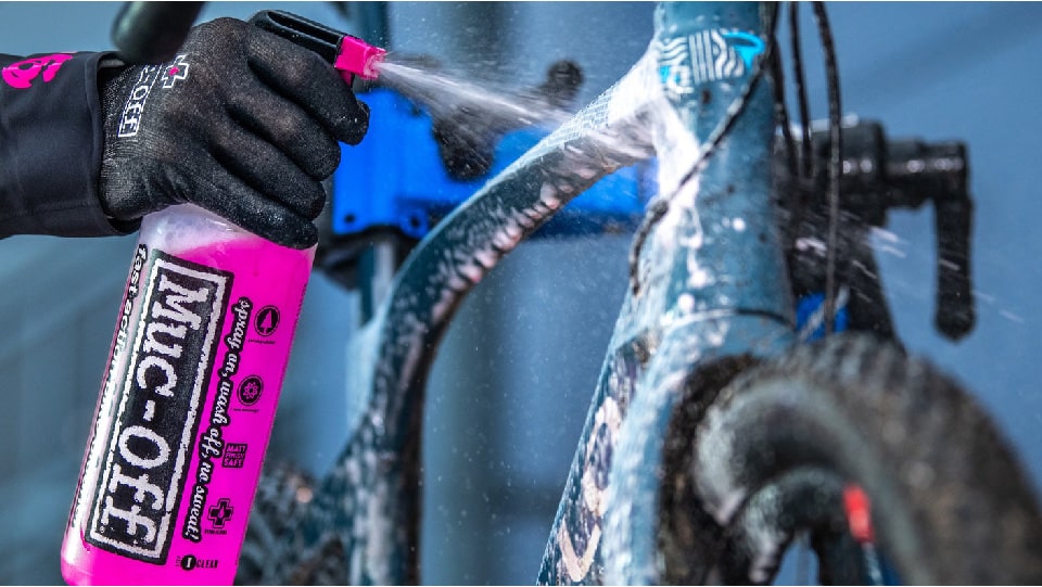 Spraying Bike with Cleaner