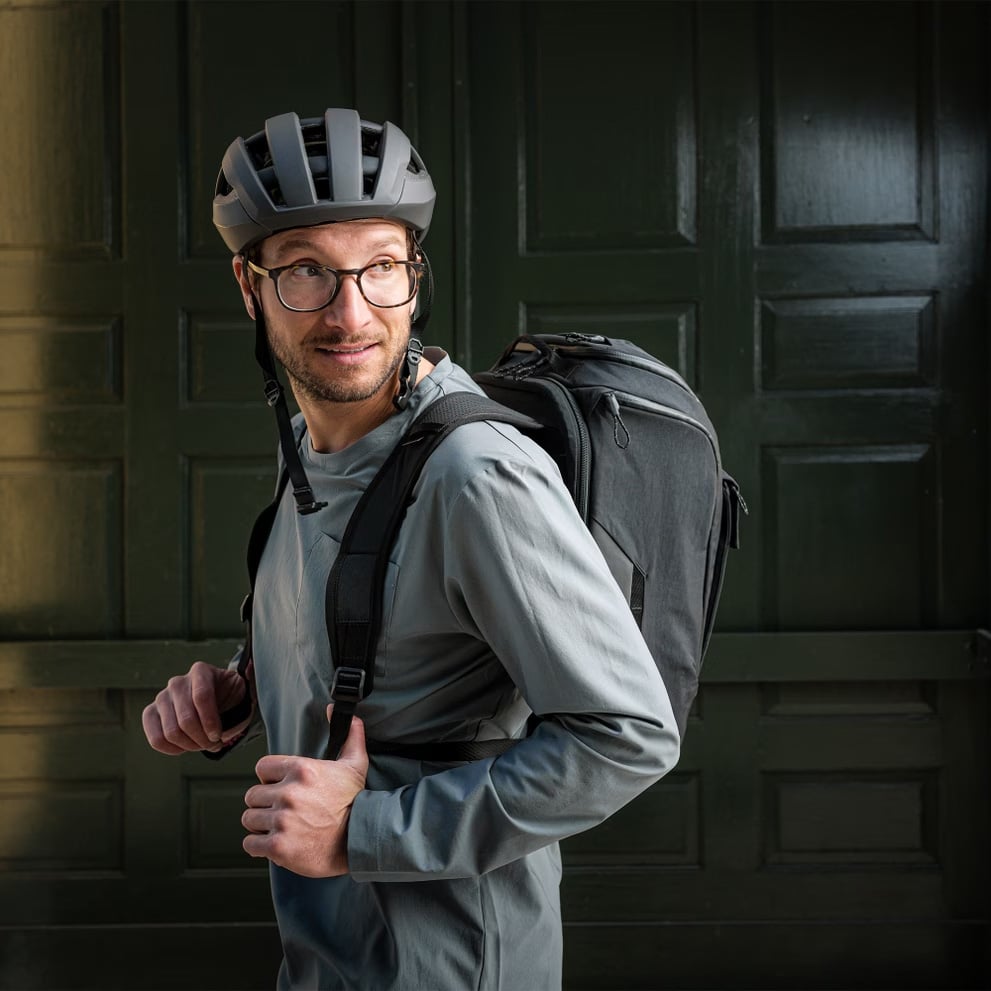 Thule Paramount Hybrid Pannier Backpack worn as backpack by man