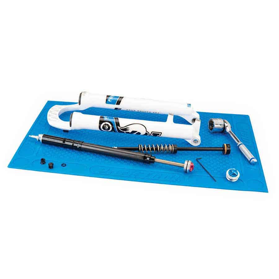 PARK TOOL OM-2 Benchtop Overhaul Mat with various tools on top