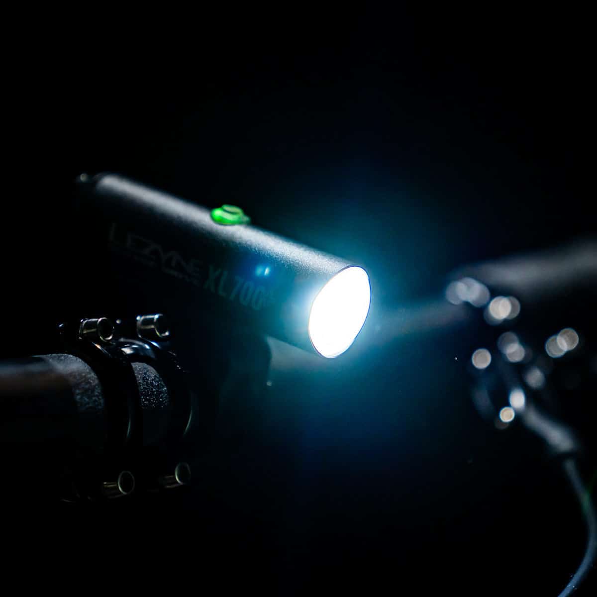 LEZYNE Classic Drive XL 700+ Light attached to handlebar with light on angle