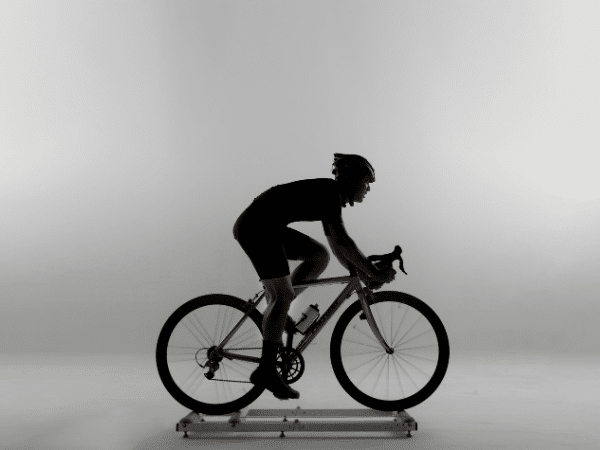 Man cycling indoors on rollers