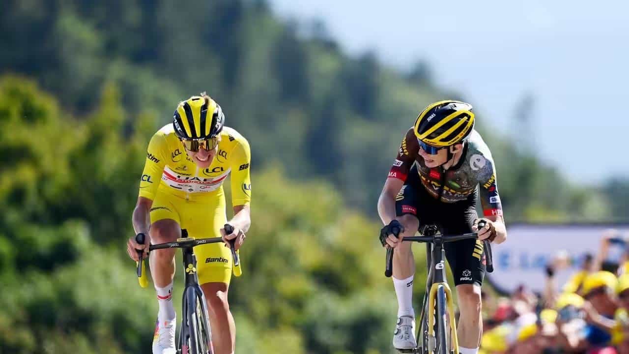 tadej and jonas riding beside each other at the tour de france