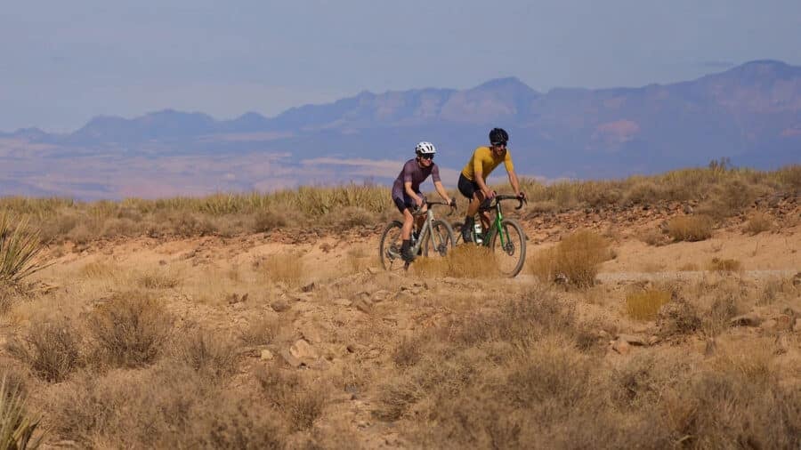 Two cyclists riding in dry climate with Shimano components