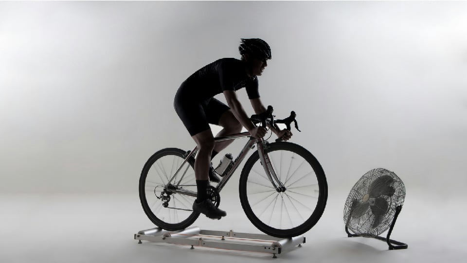 Smart Trainer Vs Rollers: Cyclist on indoor trainer