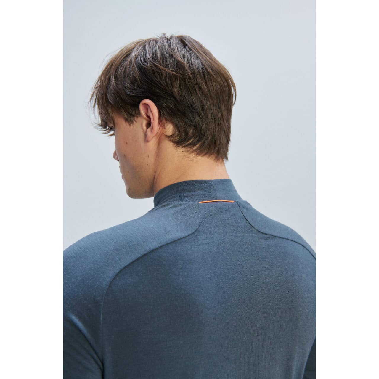 POC Merino Baselayer Mock Neck Jersey on man close up of shoulders